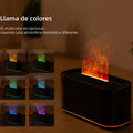Humidificador multicolor con efecto de llama LED decorativa sobre mesa de madera.