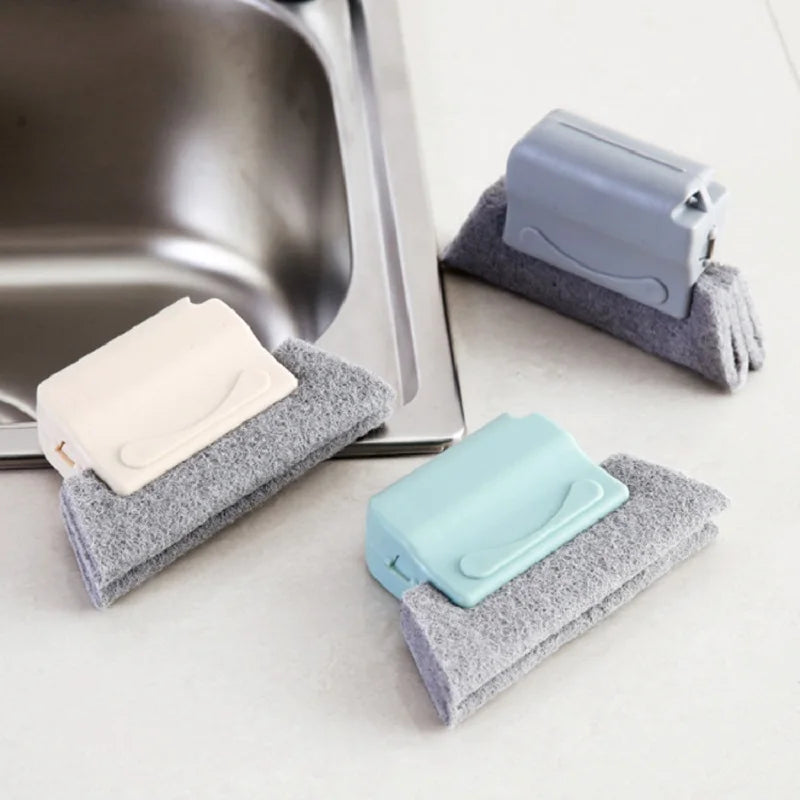 Esponjas de limpieza multiusos para cocina junto al fregadero, colores pastel