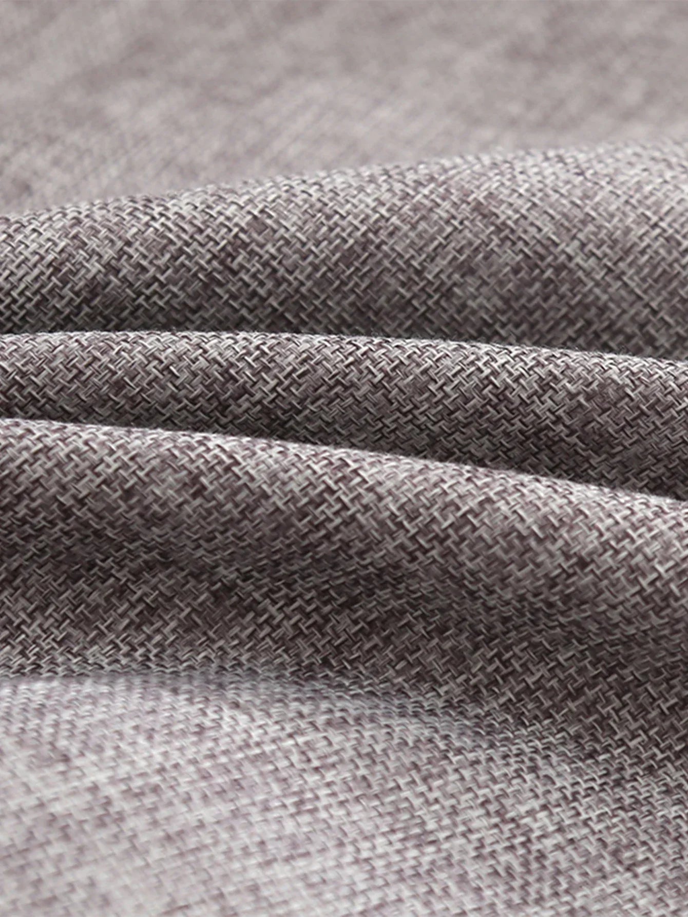 Tela texturizada gris claro para accesorios de hogar modernos, close up del tejido