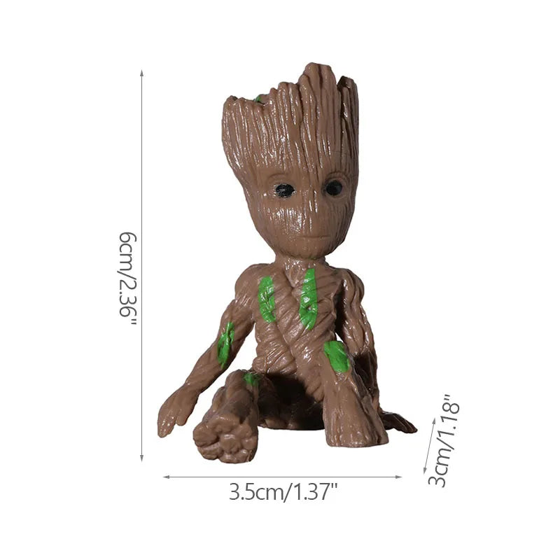 Figura decorativa de árbol pequeño marrón con detalles verdes, medidas 6x3.5x3 cm, ideal para hogar moderno.
