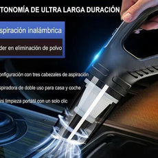 Aspiradora portátil inalámbrica negra limpiando superficie, ideal para coche y hogar, tecnología LED.